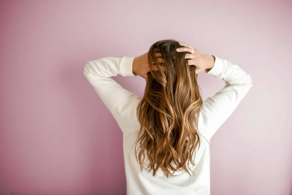 Woman with soft face-framing curtain bangs